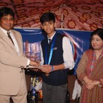 Rana Ifham Sardar from LGS EME receiving gold medal and a cash prize of Rs. 8,000/- for winning the title of The Little Master of Lahore Chess Tournament U-13 age group