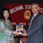 The Chief Guest, Prof. Dr. Asif Ali Qaiser, receiving a souvenir and a copy of the school magazine from LSS MD Dr. Salma Mian.