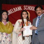 Hira Hameed, receiving Dr. Hamayun Mian Award, carrying a medal and a cash prize of Rs. 40,000/- from the Chief Guest, Prof. Dr. Muhammad Arif Khan