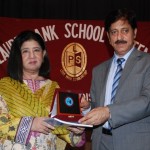 The chief Guest, Prof. Dr. Muhammad Arif Khan, receiving a souvenir and a copy of the school magazine from Dr. Salma Mian, the Managing Director LSS.