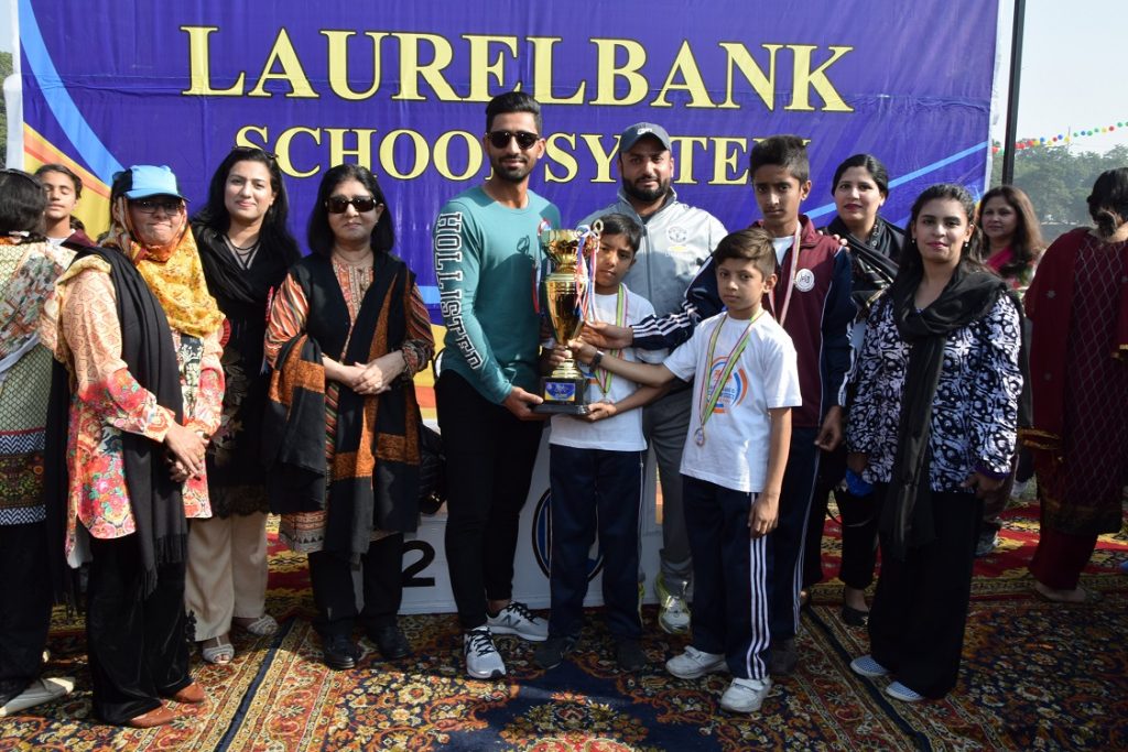 Captain of Hali House Receiving ‘The Best House Trophy’